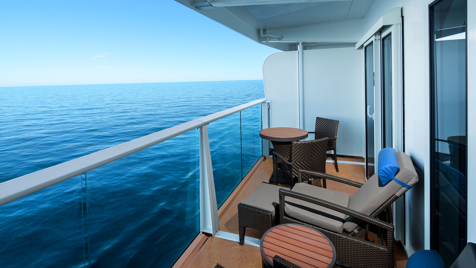 Spacious balcony with two chairs and table
