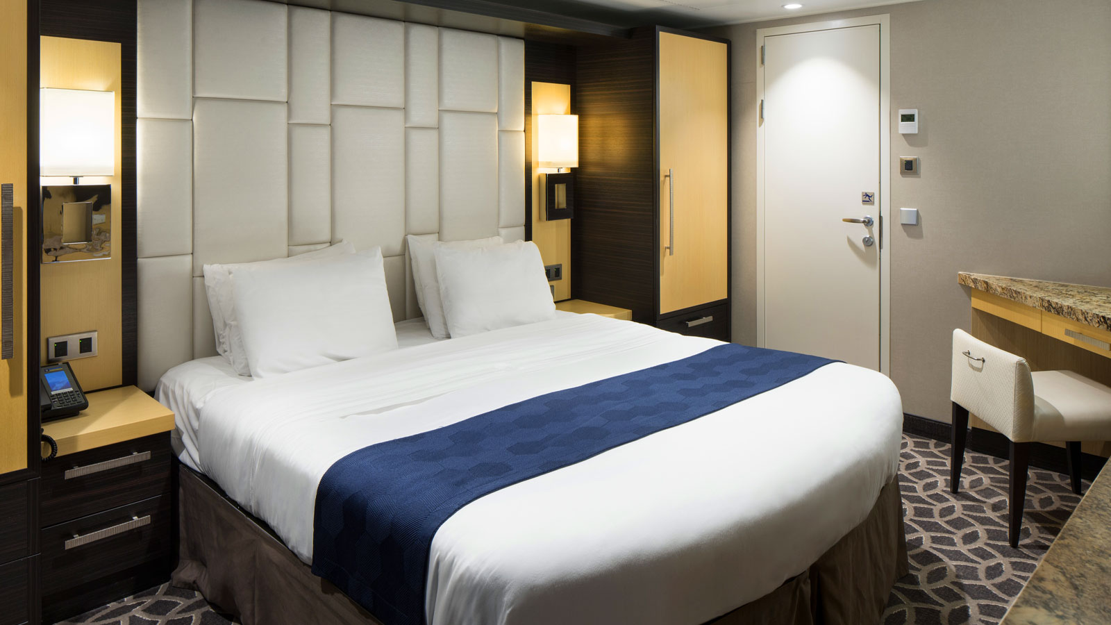 View of the bedroom with bed and television