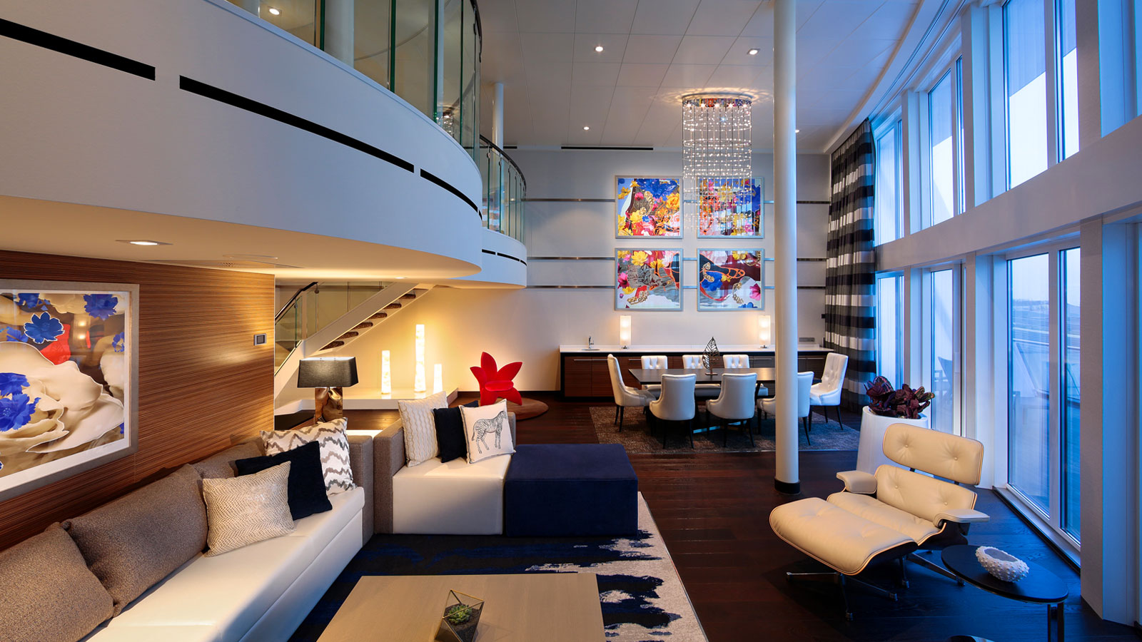 Living room view including sofa, side chairs, coffee table and ample additional seating.