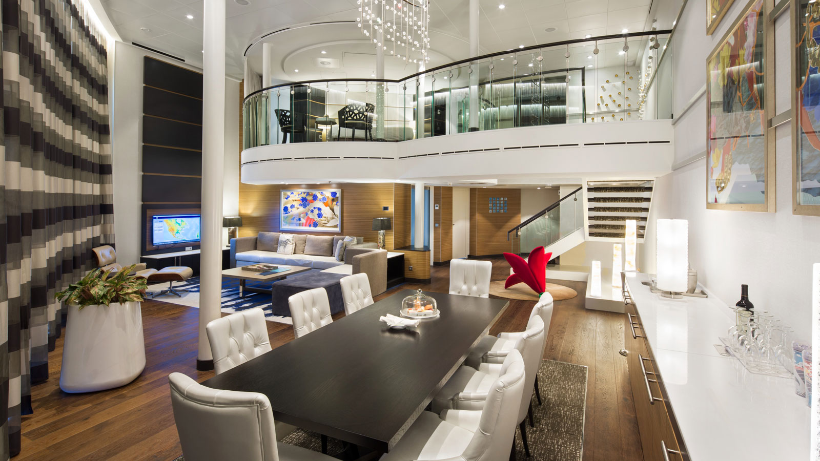 Primary bedroom on the second level loft overlooking the bottom level and pristine ocean views