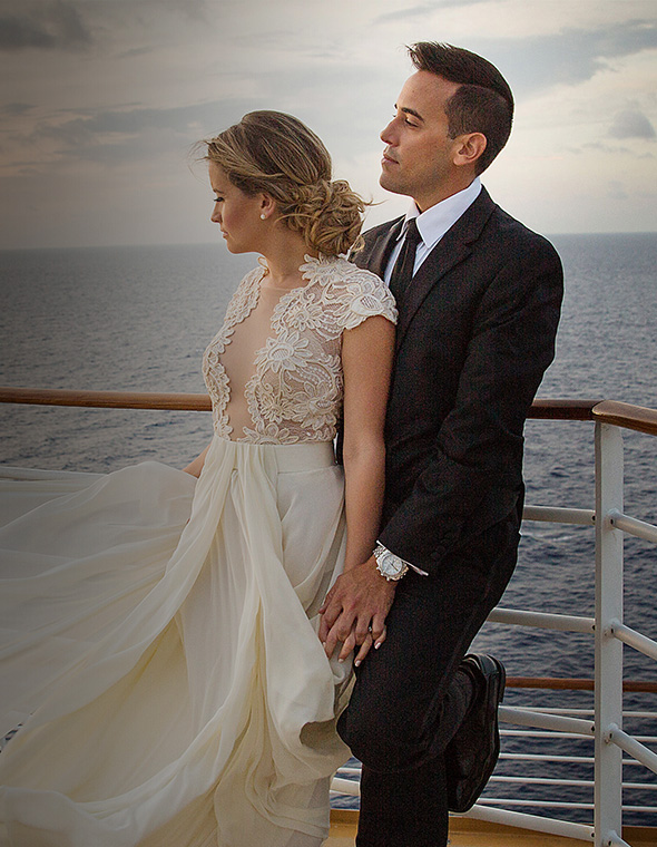 Bride and Groom posing for a picture onboard a cruise.