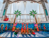 Performers dancing on stage during the Hideaway Heist Cruise Show by Royal Caribbean