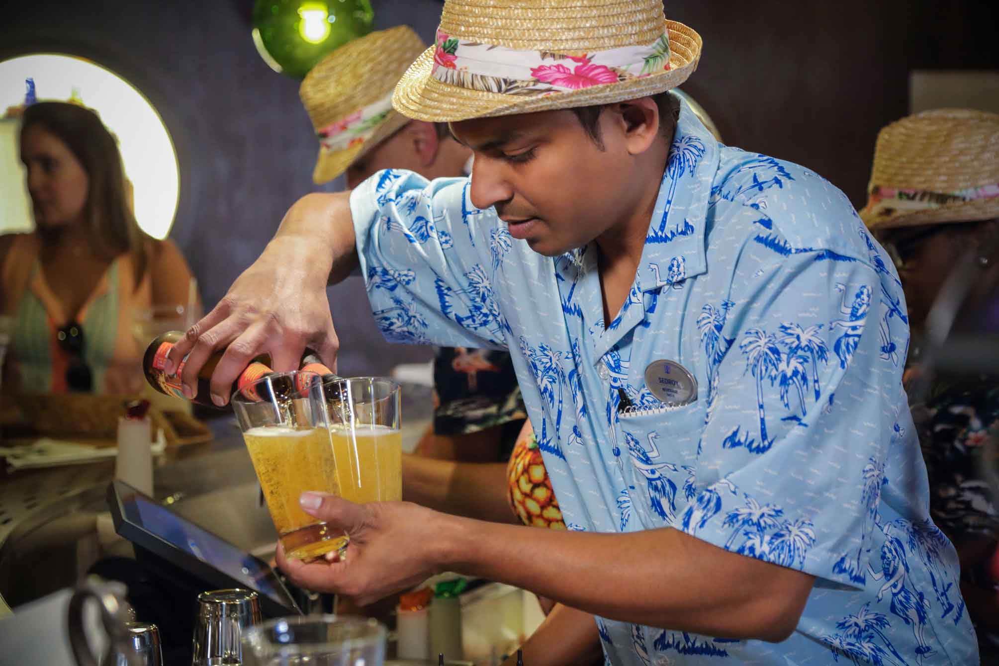 Bartender Pouring Foamy Beers at the Bamboo Room.