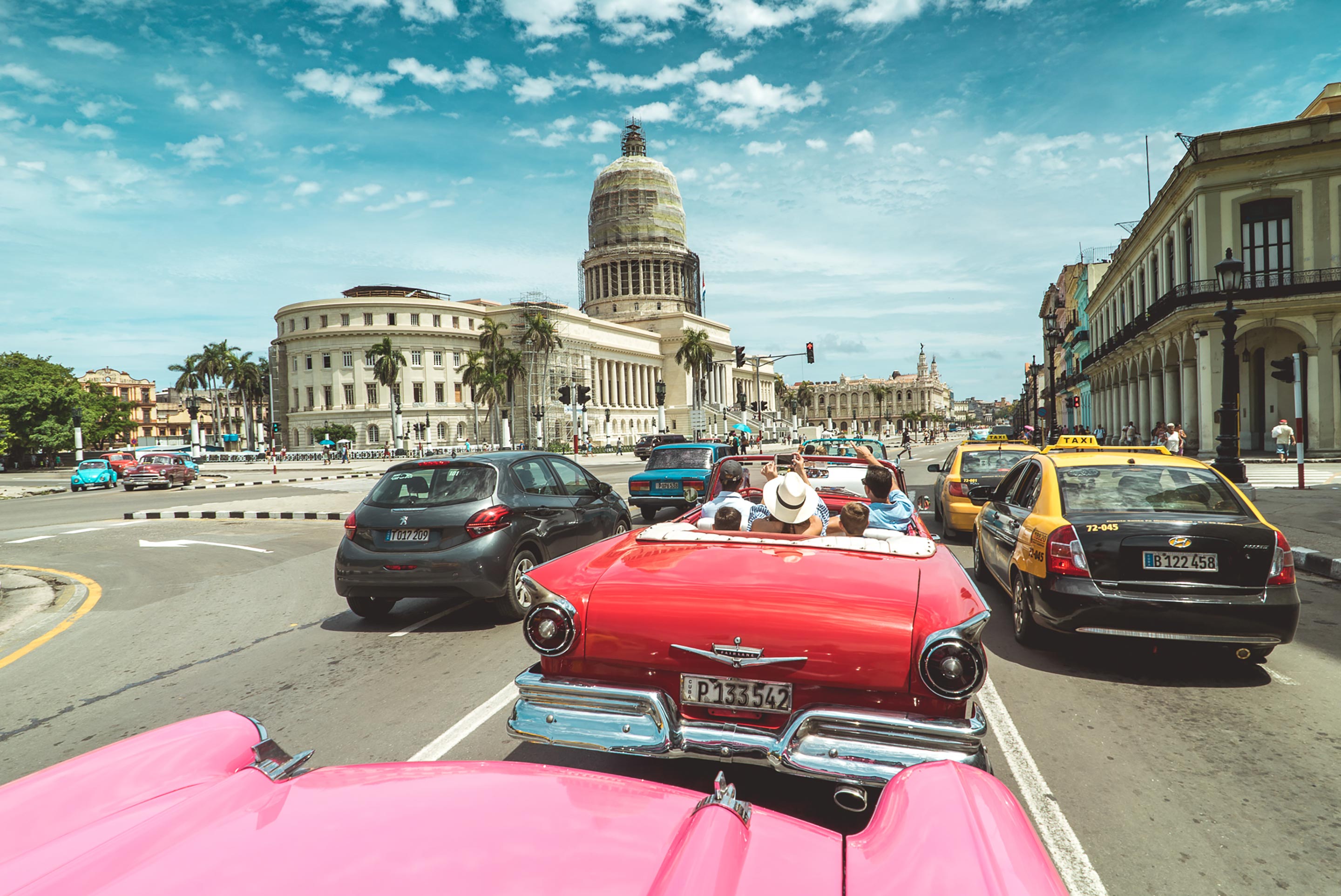 Vintage Cars in a Popular Street in Cuba