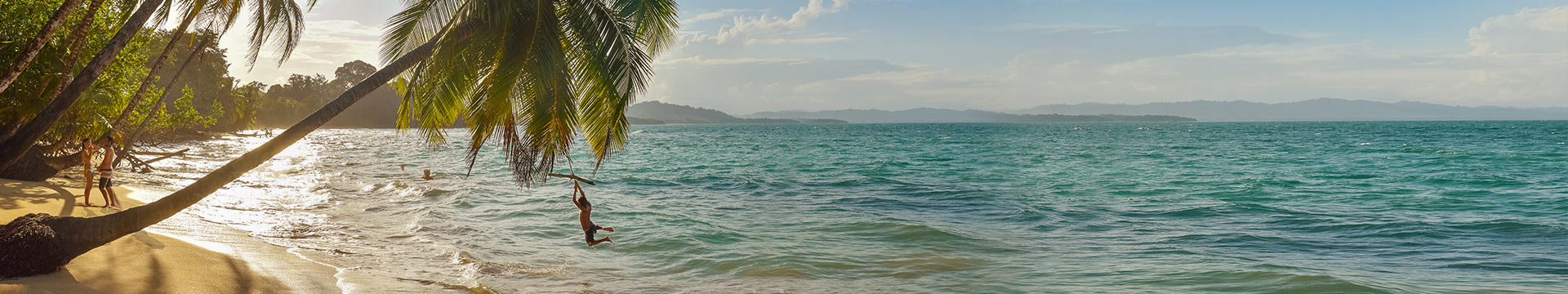 image of ship sailing into the sunset