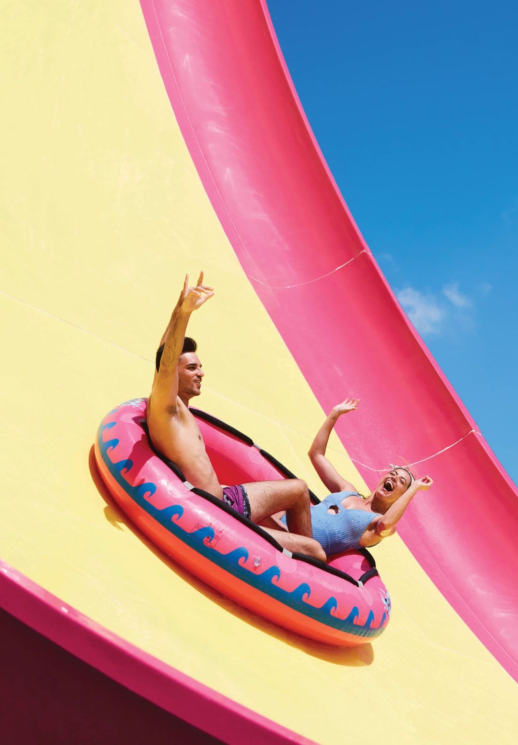 Couple enjoying waterslide