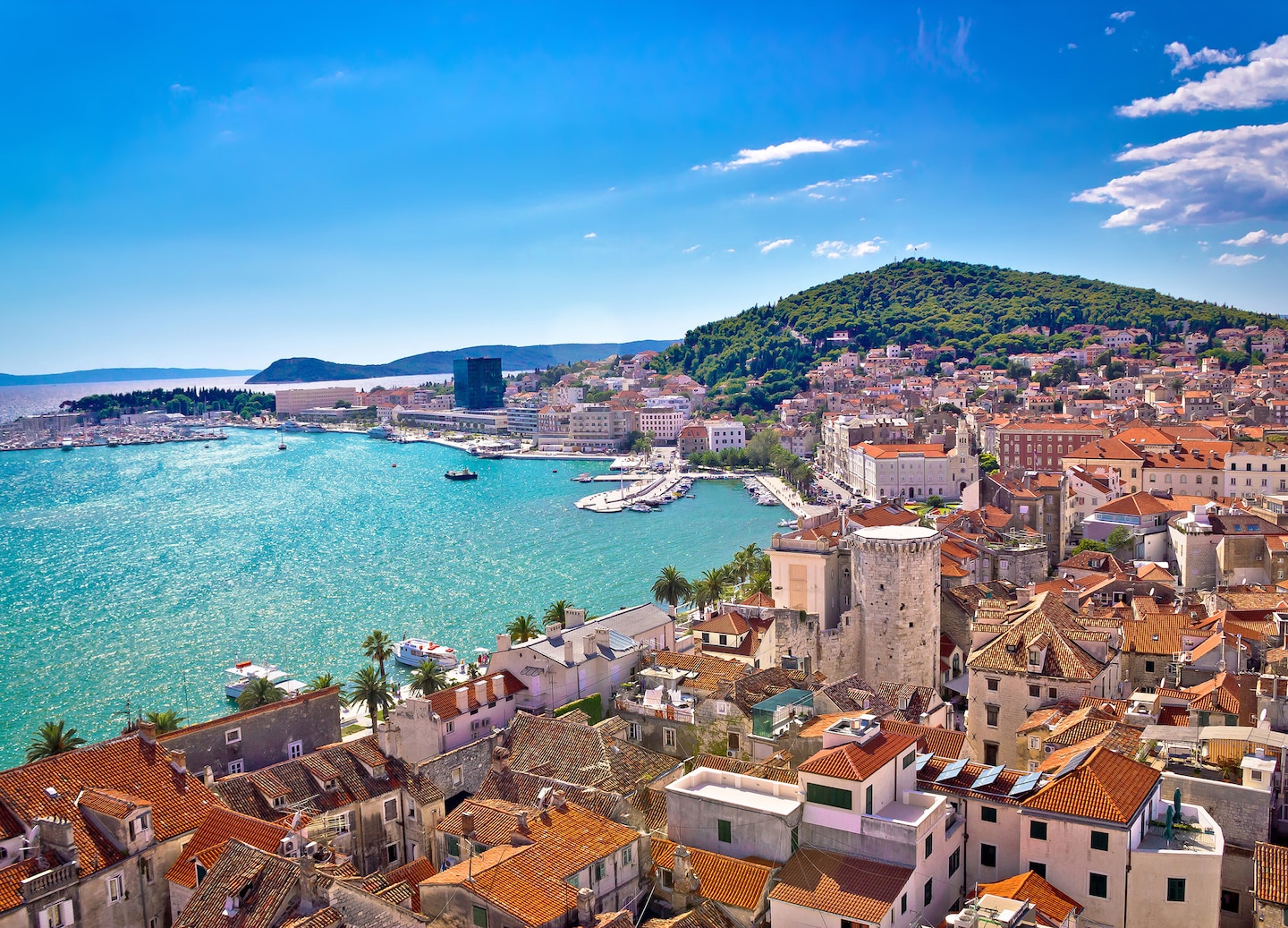 Split’s Riva Waterfront, with bright blue Adriatic water and historic stone buildings. - Split, Croatia