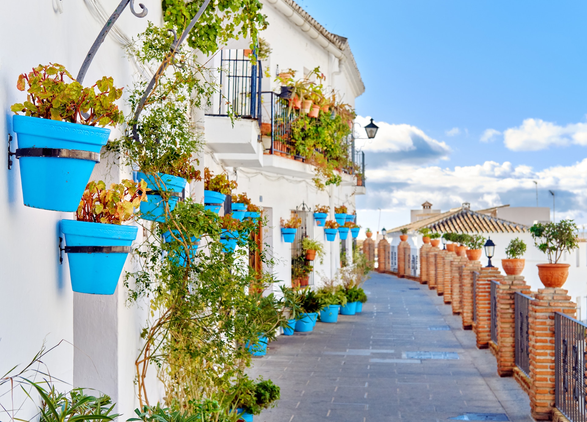 idyllic scenery empty picturesque street of small white washed village of mijas path way decorated