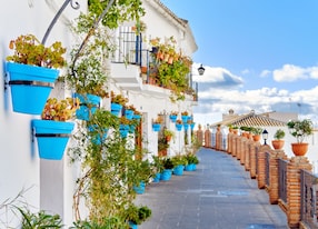 idyllic scenery empty picturesque street of small white washed village of mijas path way decorated