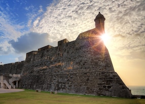 beautiful view of the large outer wall with sentry box of fort san cristobal in san juan puerto