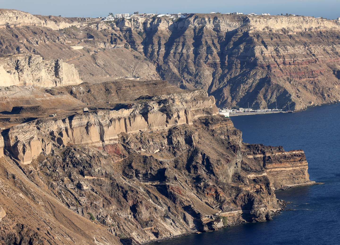 Imerovigli’s white cliffs overlook expansive blue sea. - Santorini, Greece
