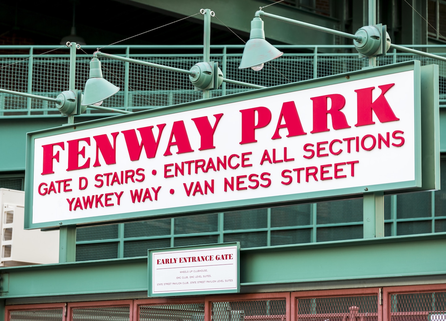 Fenway Park’s historic brick façade and green accents stand along the street in Boston’s Fenway district. - Boston, Massachusetts