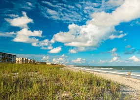 beautiful cocoa beach florida with blue sky and clouds