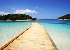 ksamil village on albania s adriatic coast boasts beautiful pale sand and turquoise sea the