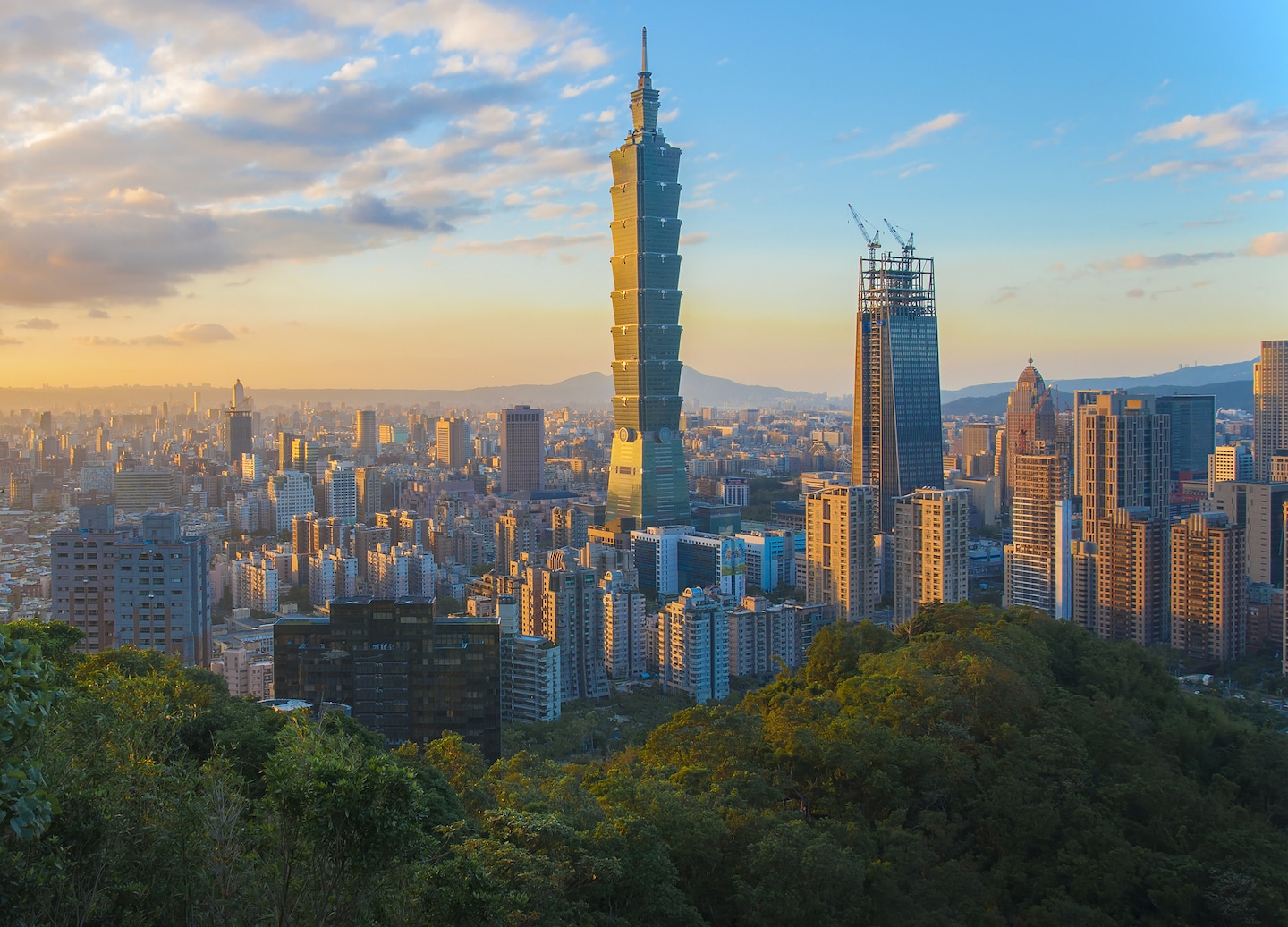 Taipei’s skyline glows at sunset. - Taipei