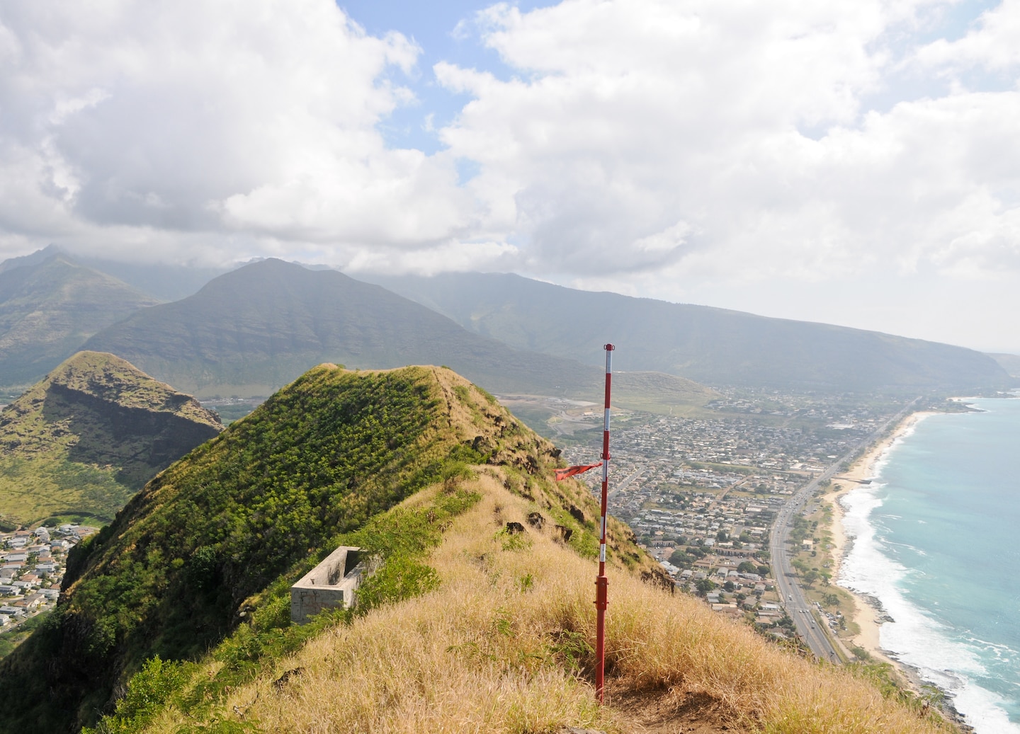 A panoramic view from the Wai‘anae summit overlooks Oahu’s coastline, blue ocean, and rugged cliffs. - Honolulu, Oahu, Hawaii