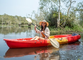 asian woman on kayak