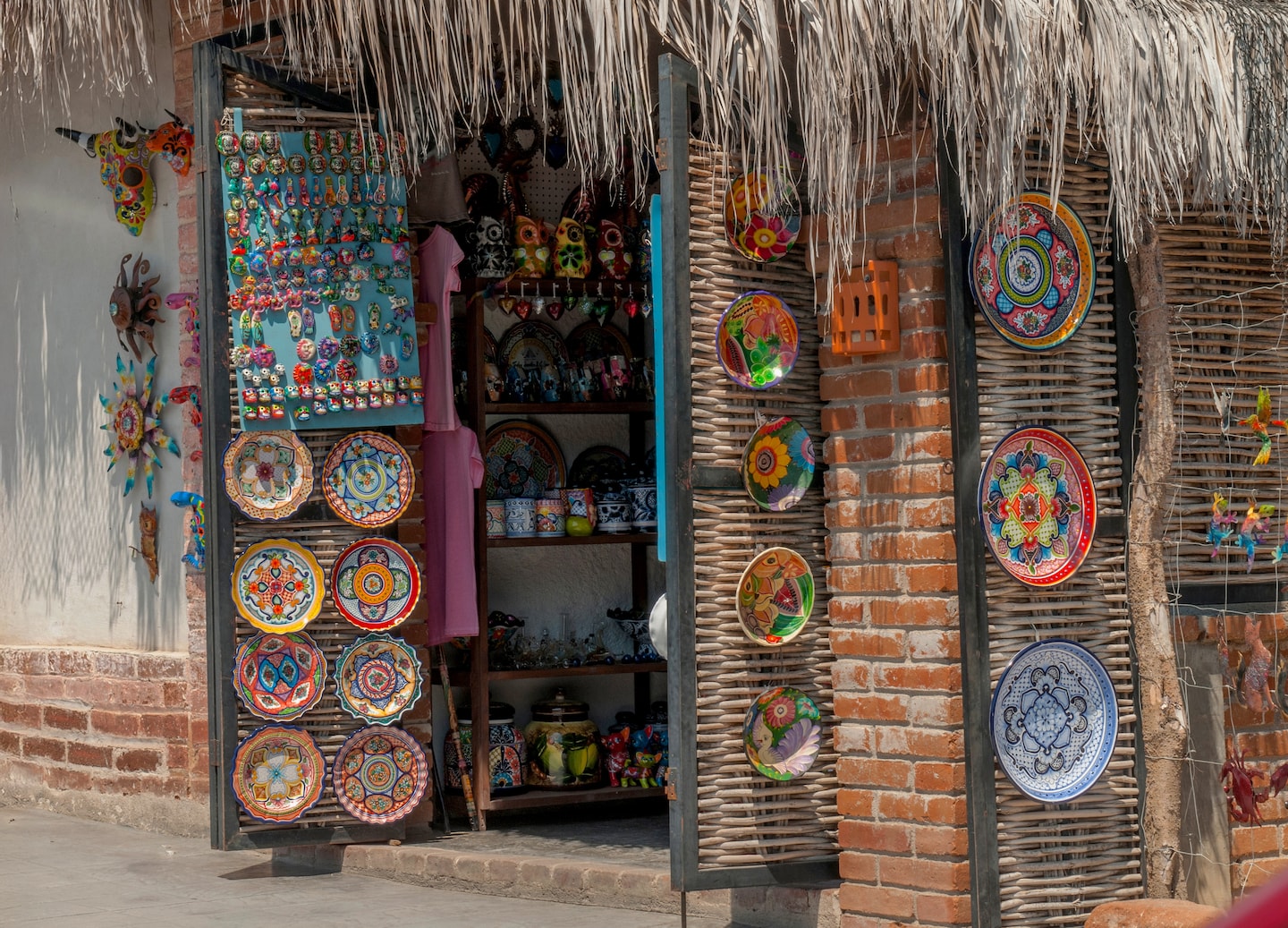 Colorful artisan shop in Todos Santos displays handcrafted textiles, pottery, and vibrant local décor. - La Paz, Mexico