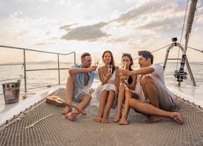 group of people toasting onboard boat