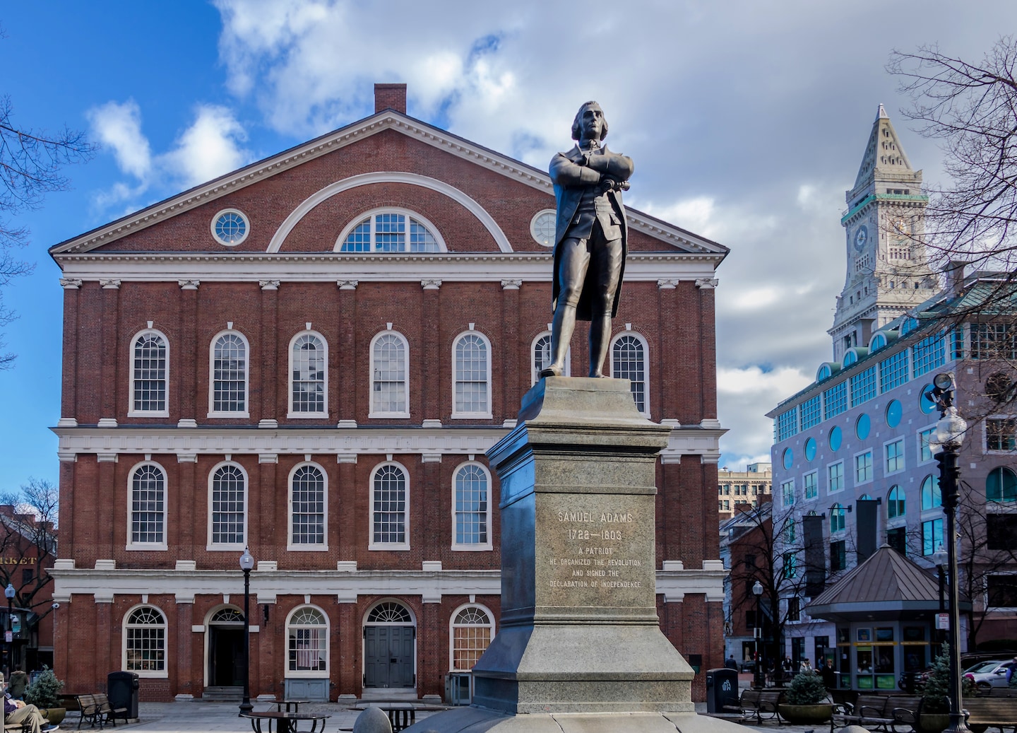 Faneuil Hall’s brick exterior and white cupola rise above the plaza in Boston’s historic center. - Boston, Massachusetts