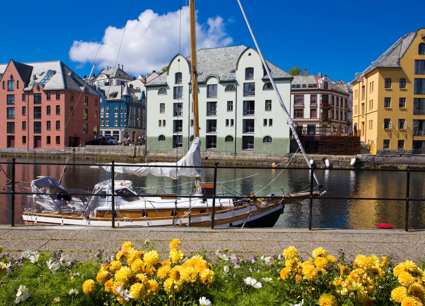 Summer offers long days, mild weather, outdoor adventures, festivals, and vibrant cultural experiences. - Ålesund, Norway 