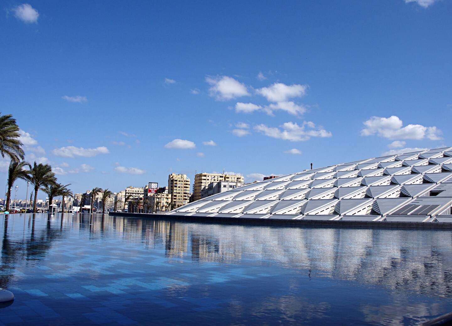 Modern Bibliotheca Alexandrina curves toward the sky, celebrating Egypt’s enduring knowledge. - Alexandria, Egypt
