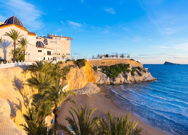 benidorm alicante playa del mal pas beach at sunset in spain with palm trees