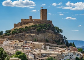 top of the hill with biar castle and town at dusk in alicante spain
