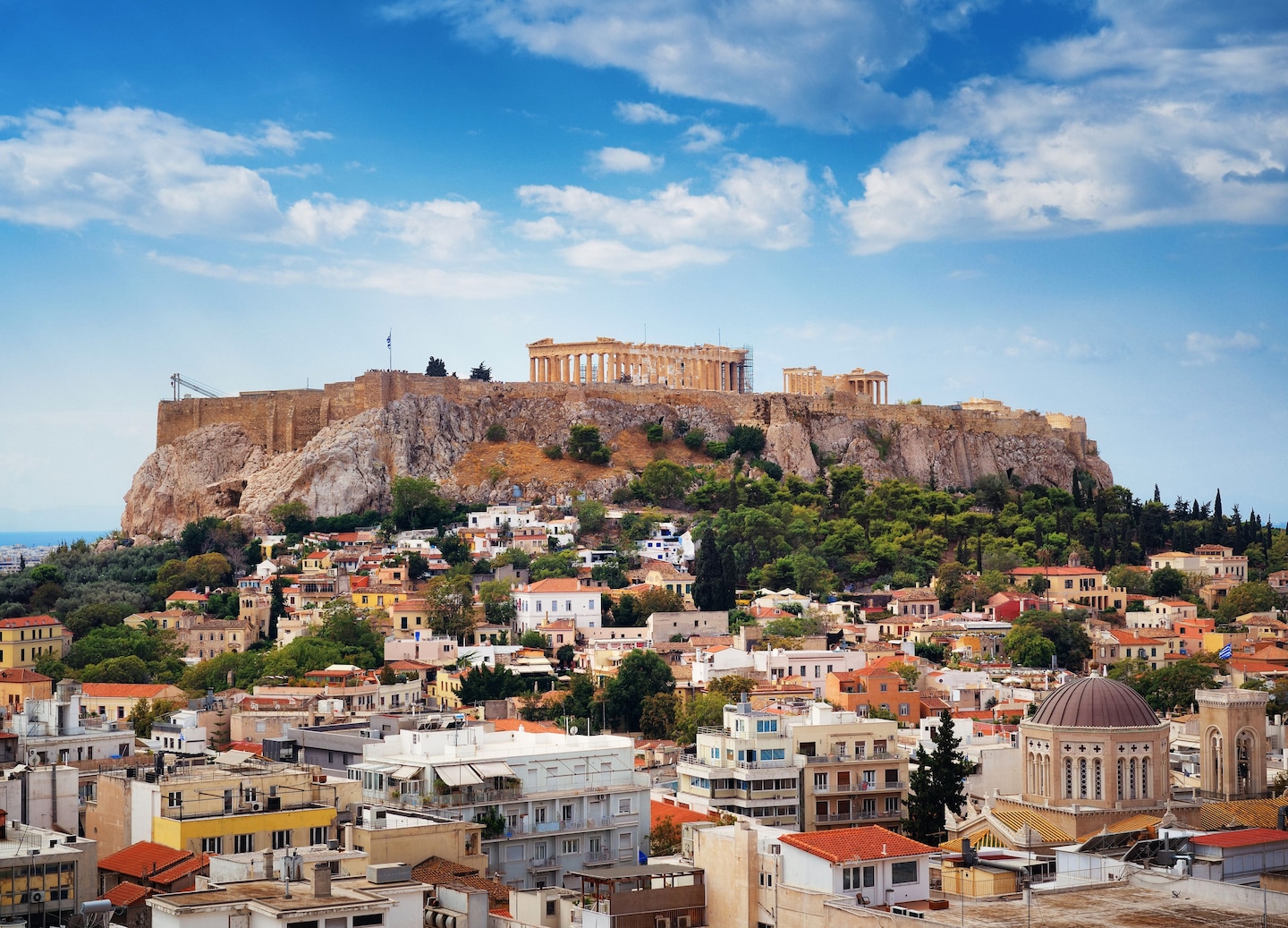 Athens skyline above historic rooftops. - Athens, Greece