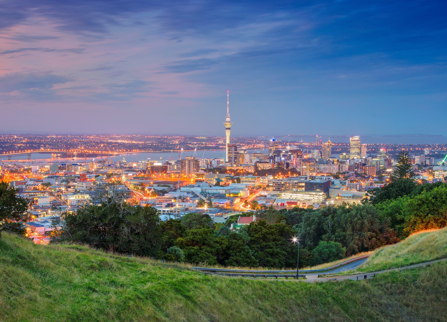 Auckland view from Mt. Eden at sunset with a glowing sky. - Auckland, New Zealand