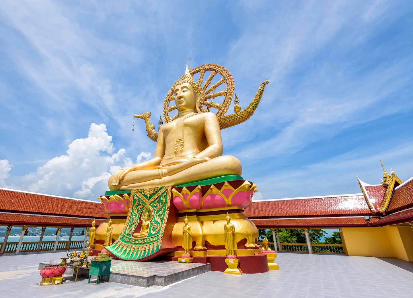 A large golden Buddha sits peacefully atop a hill, shining brightly under Pattaya’s clear blue sky. - Bangkok (Laemchabang), Thailand