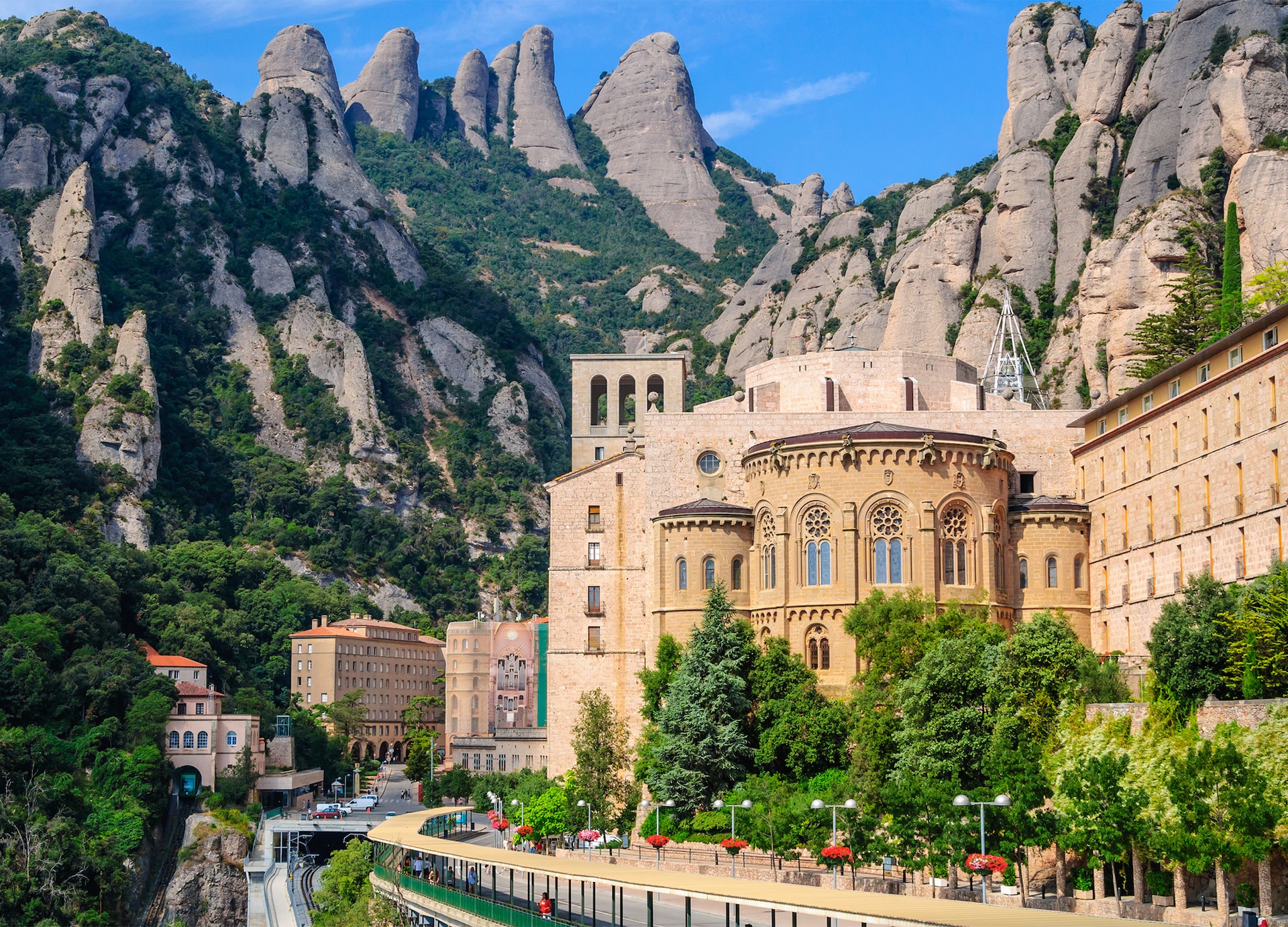 view the famous catholic monastery of montserrat on the background of round rocks blue sky