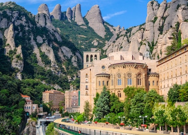 view the famous catholic monastery of montserrat on the background of round rocks blue sky