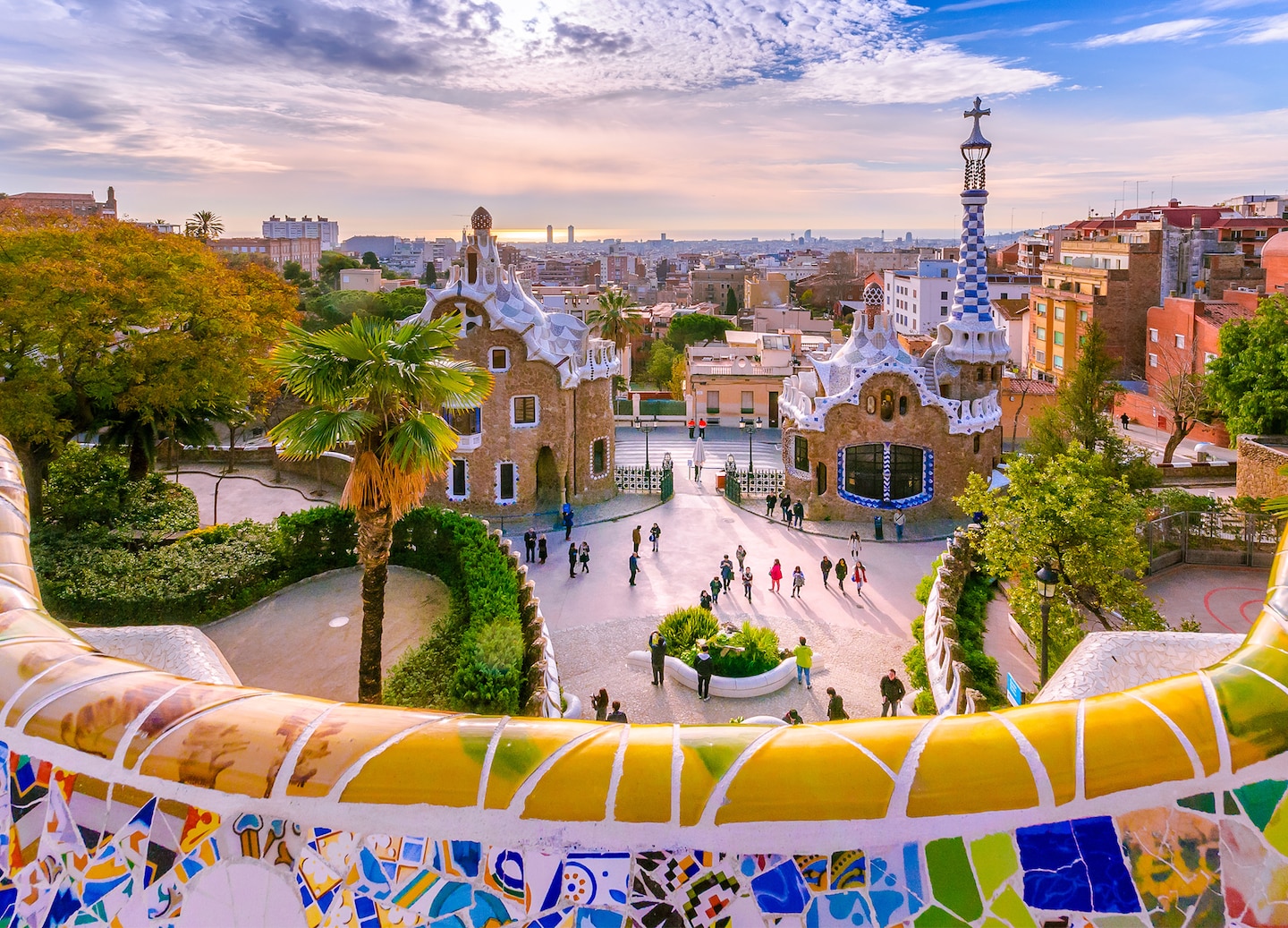 Park Güell overlooks Barcelona with colorful mosaic terraces and wide views across the city. - Barcelona, Spain
