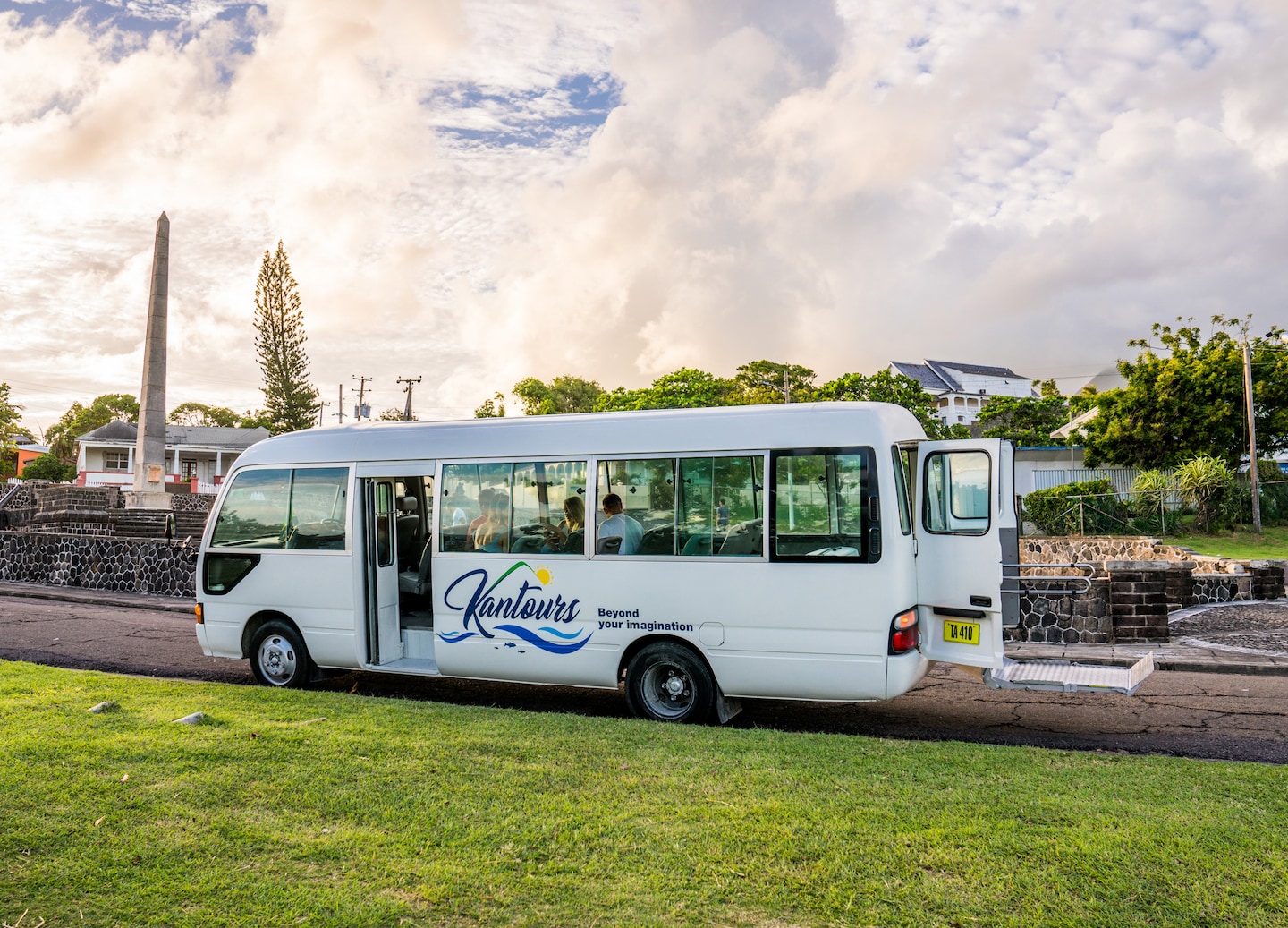 Wheelchair‑accessible tour bus with ramp extended, welcoming guests for a scenic St. Kitts excursion. - St. Kitts