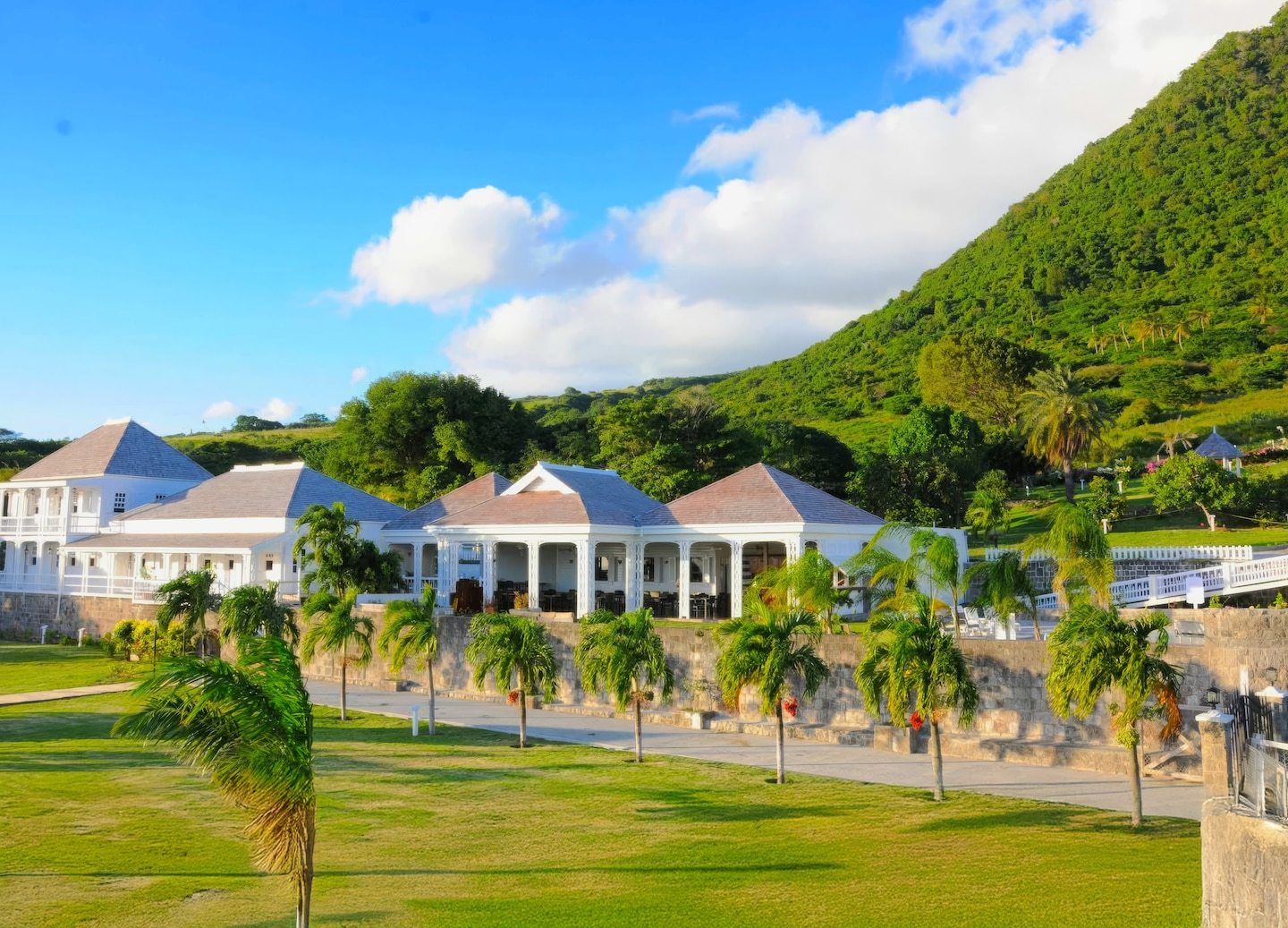 Fairview Great House with lush green mountainside behind it. - Basseterre, St Kitts & Nevis