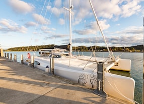 barefoot sailing lagoon bay exclusive cruise catamaran docked