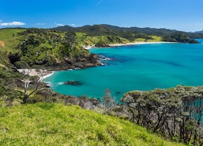summer landscape with blue sky on the pacific sea coast bay of islands northland north island