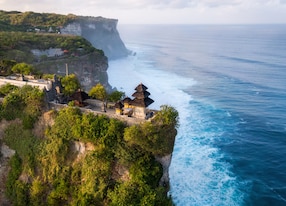 bali indonesia aerial view of pura luhur uluwatu temple at sunrise