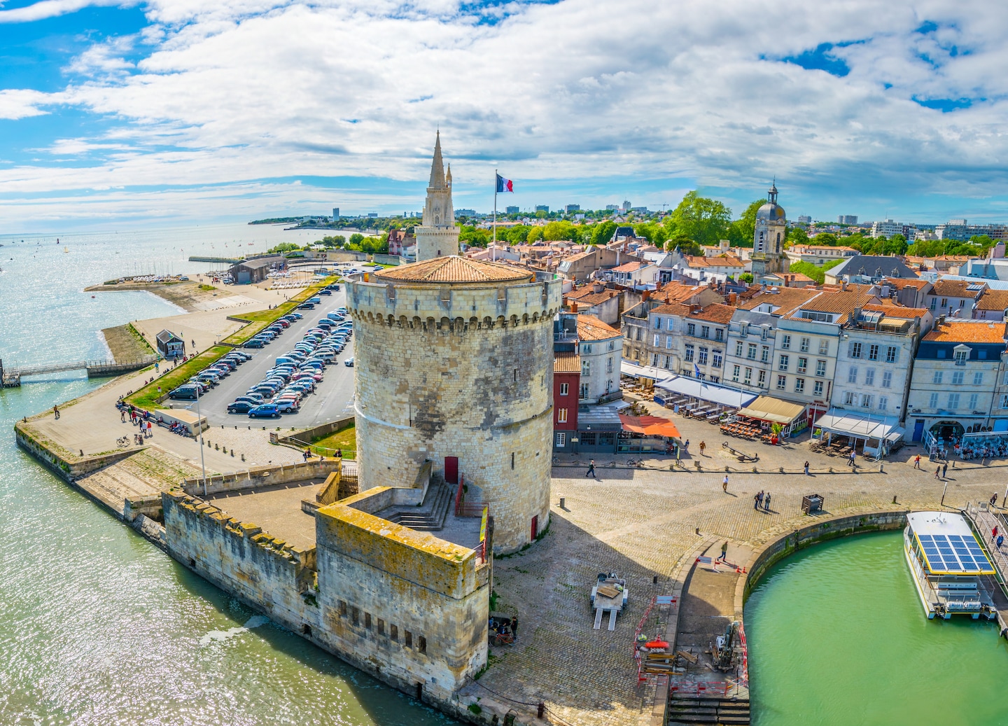 La Rochelle, a scenic Atlantic harbor town near Bordeaux, features medieval towers, a marina, cobblestone streets, and cafés. - Bordeaux, France