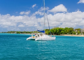 catamaran anchored turquoise water blue sky