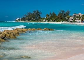 turquoise waters and white sands of accra beach on the south coast of the caribbean island of