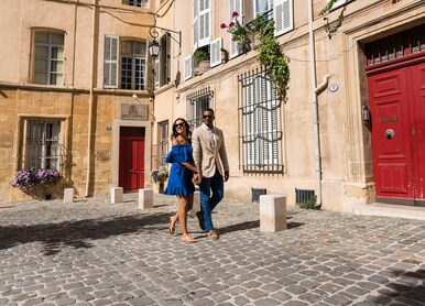 couple walking cobblestone streets alleyway