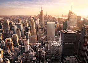 new york city skyline with urban skyscrapers at sunset usa
