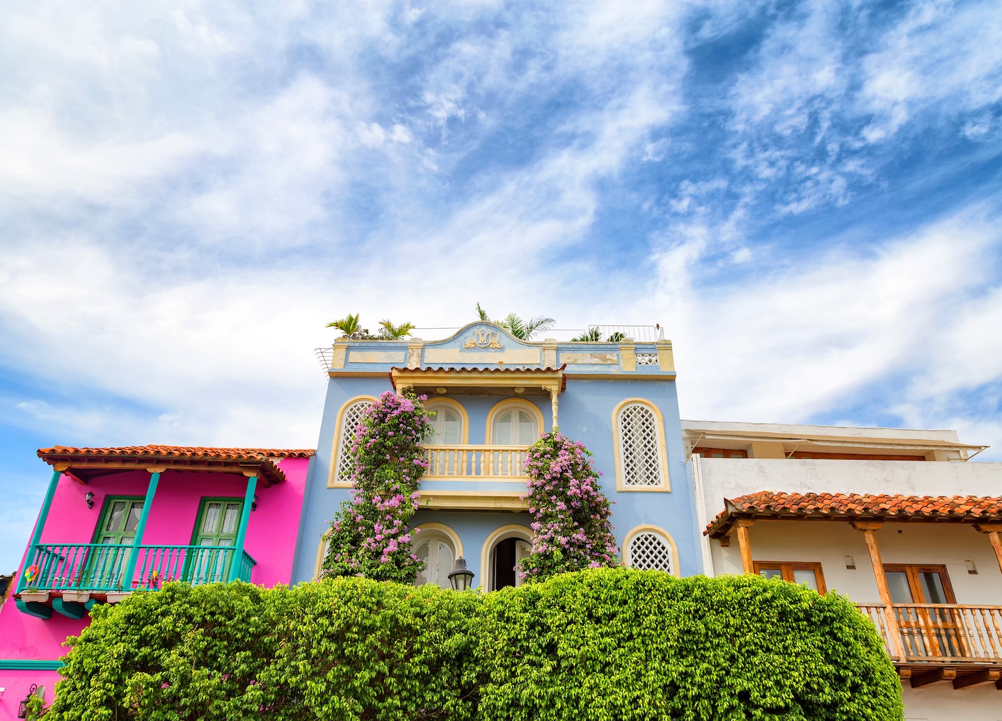 Colonial buildings in Getsemaní stand beneath dramatic clouds, adding contrast to Cartagena’s historic streets. - Cartagena, Colombia