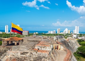 view of san felipe de barajas castle and the skyline of cartagena colombia with a large colombia