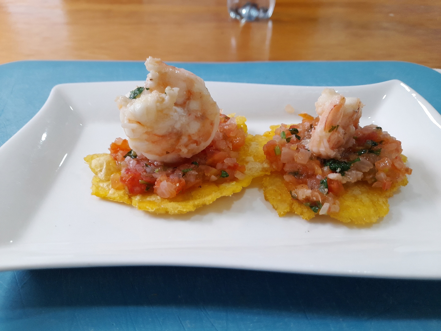 Shrimp tostones sit topped with fresh garnish, highlighting Cartagena’s bright coastal flavors. - Cartagena, Colombia
