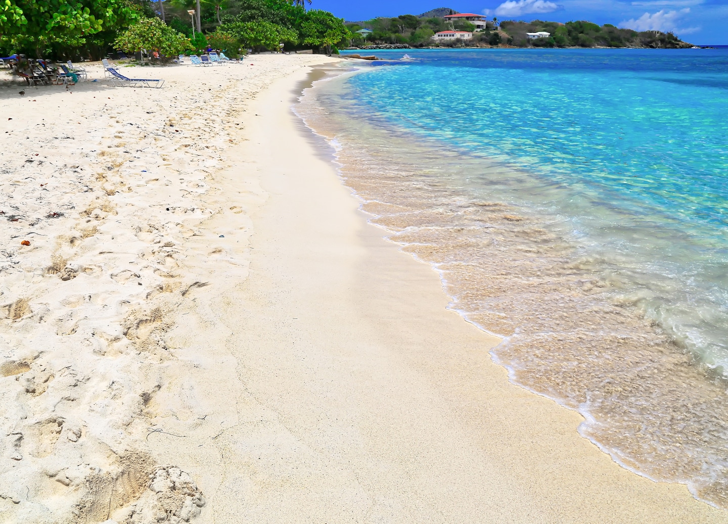 Sapphire Beach offers clear waters, coral snorkeling, watersports, and beachside amenities. - Charlotte Amalie, St. Thomas