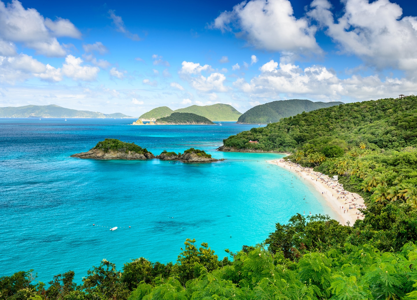 Blue water curving around white sand in St. John. - Charlotte Amalie, St. Thomas