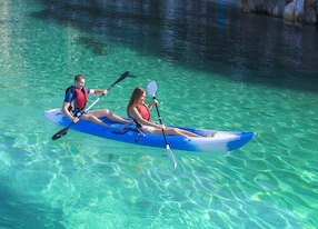 kayaking young happy couple traveling by kayak activities on the water sailing on the sea